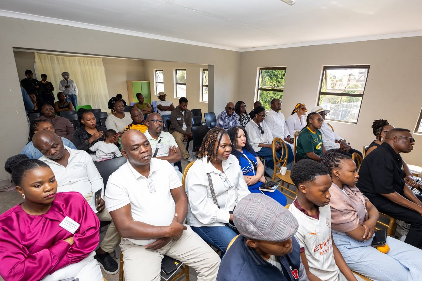 Guests seated for the Invisible Wealth book launch conversation